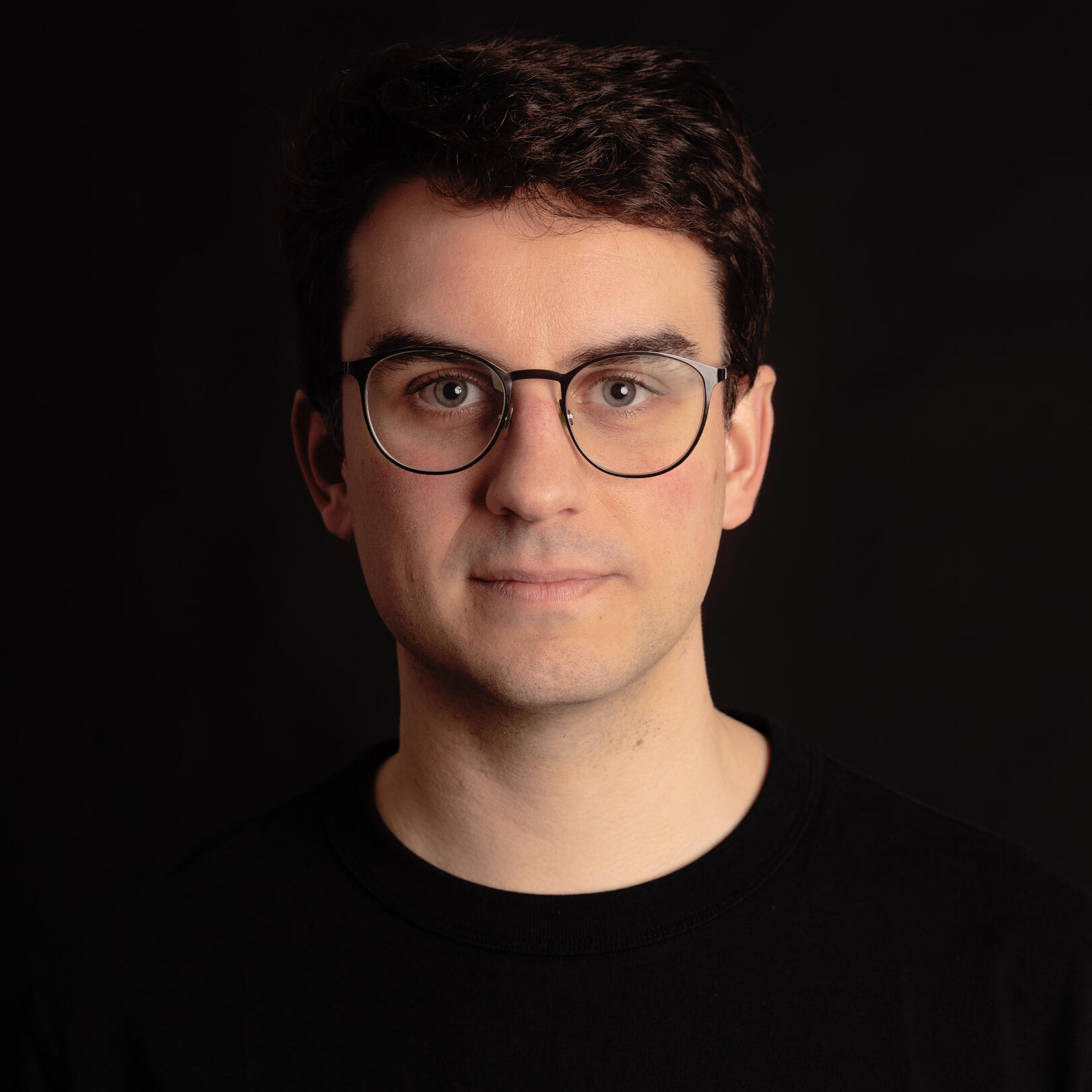 headshot Gabriel RC headshot of Gabriel RC on a black backgorund with a black t-shirt